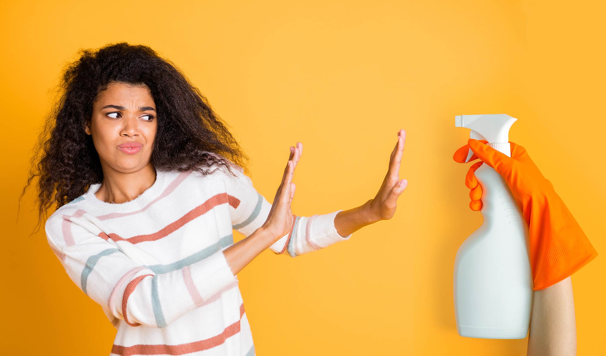 Woman pushing away cleaning product 