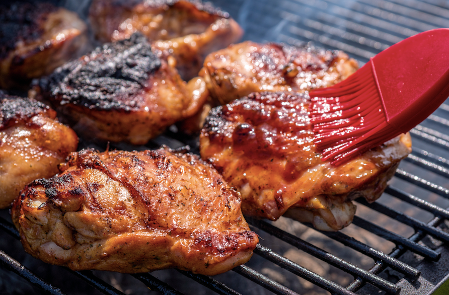 barbecue chicken thighs on the grill