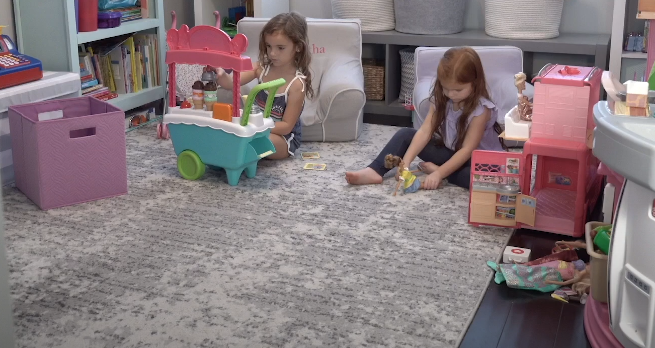 little girls playing in their room 