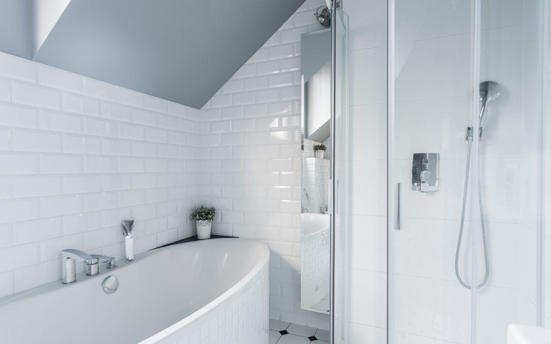 shot of bathtub and shower stall 