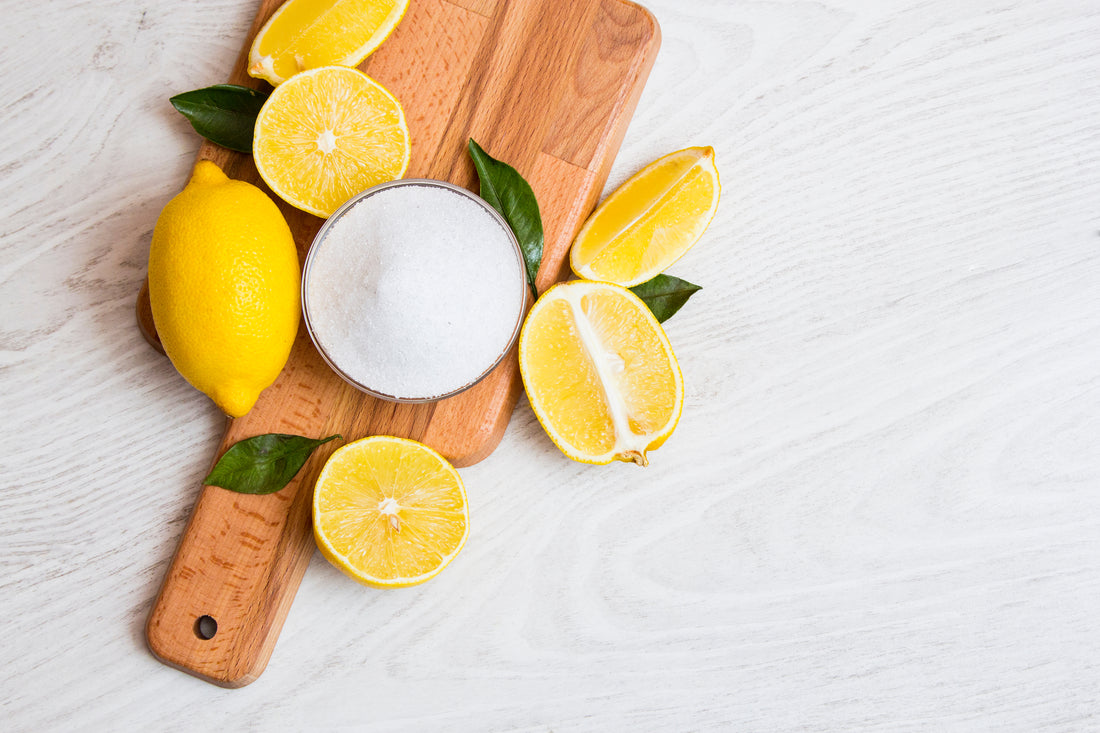 chopping board with lemons and citric acid 