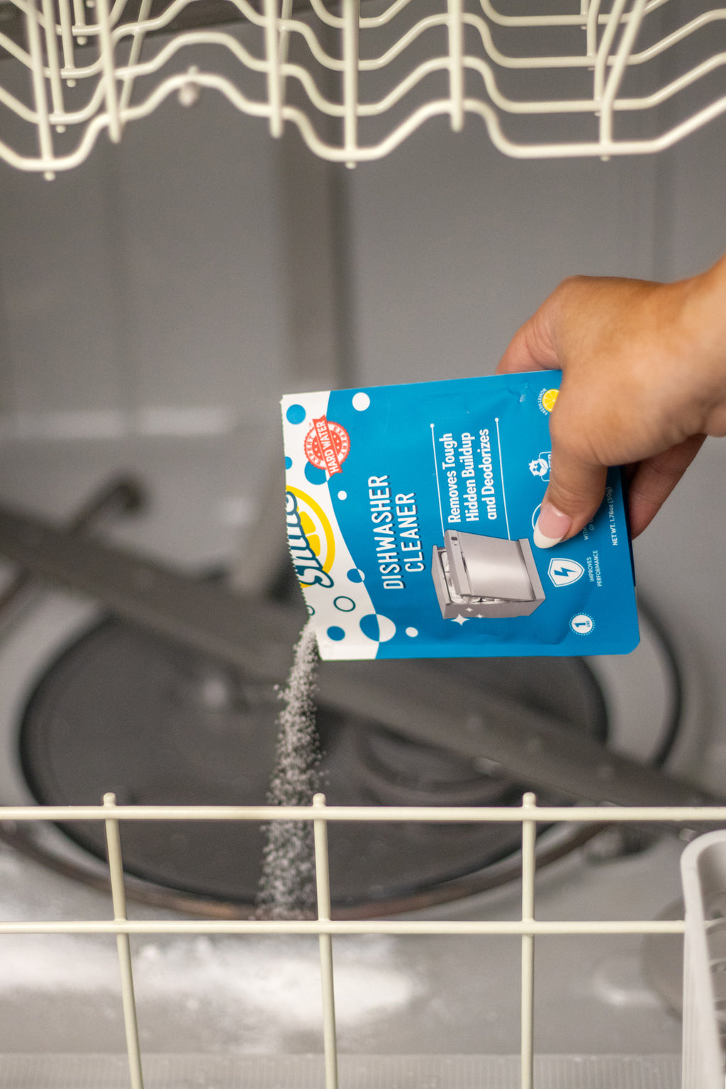 Placing Dishwasher cleaner in a dishwasher