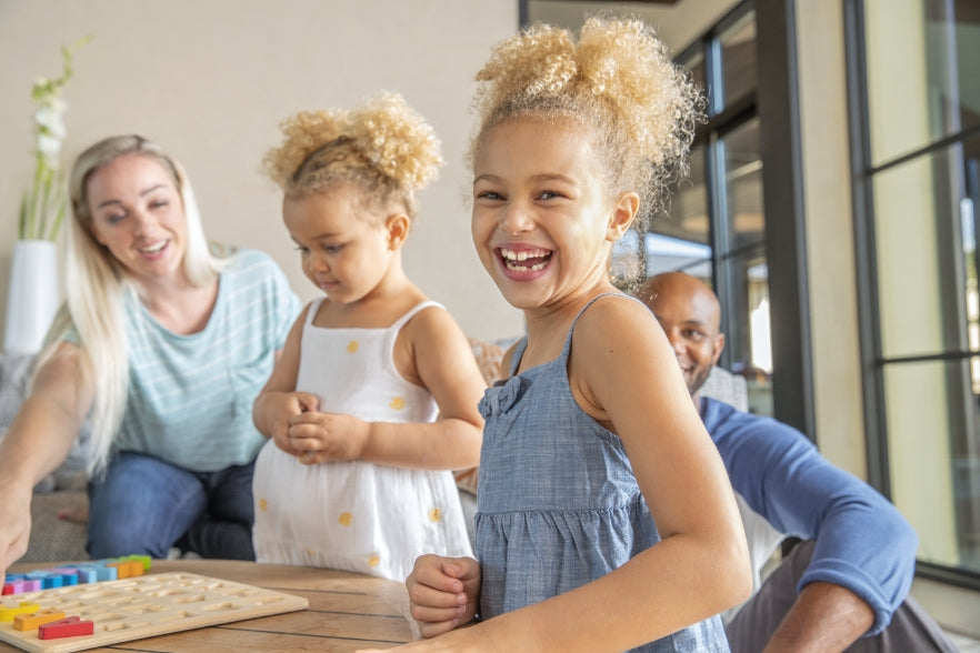 A family playing a game in a clean home